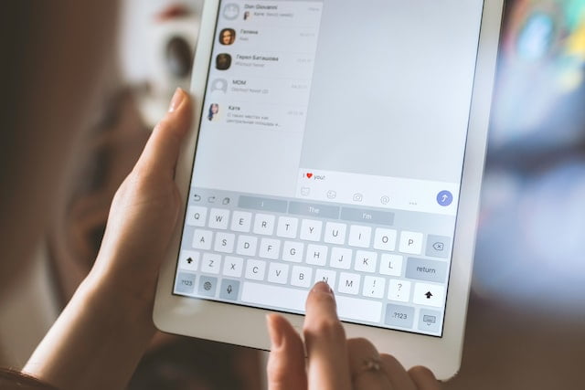 women using tablet showing how to write a discord bot

